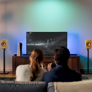 Online use only_KEF_LSX II_Amber Haze_pair_with tv_on stand_front.jpg